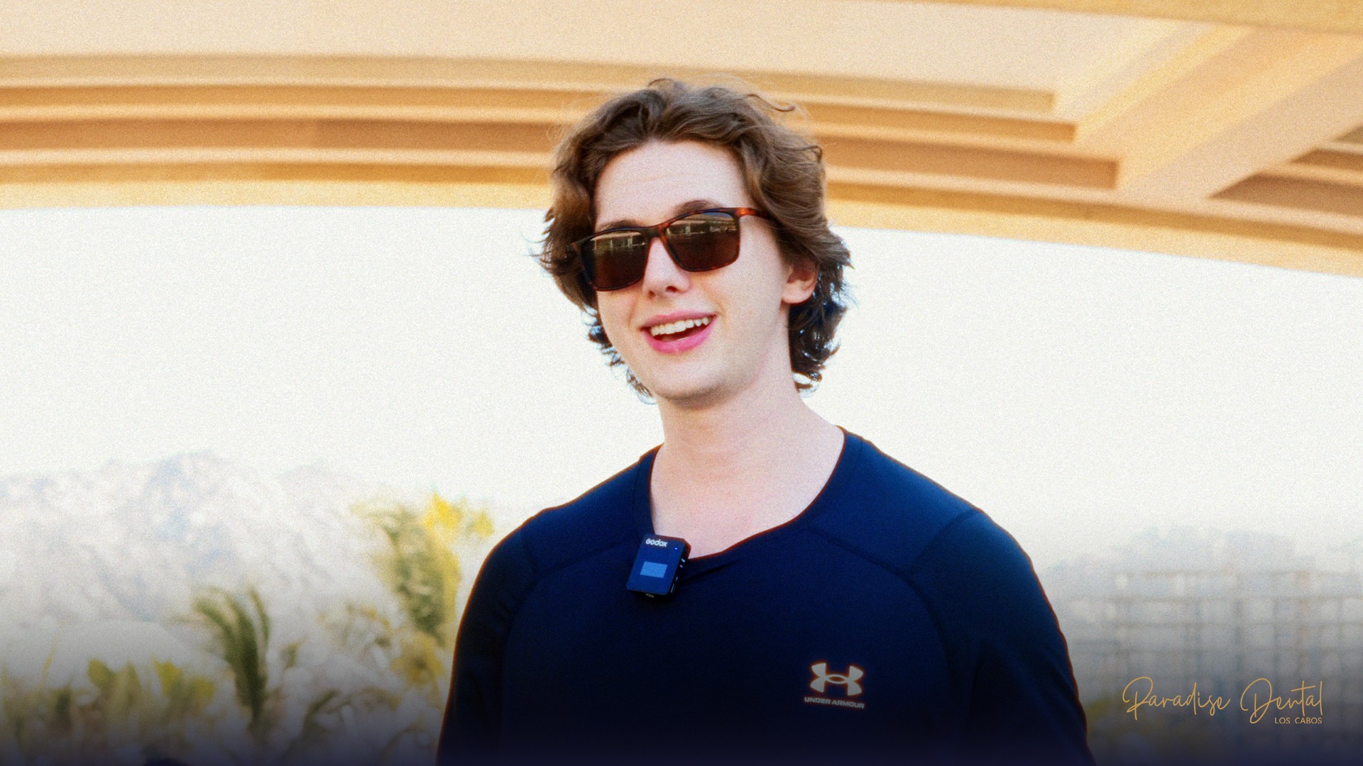 young-man-smiling-with-dark-glasses